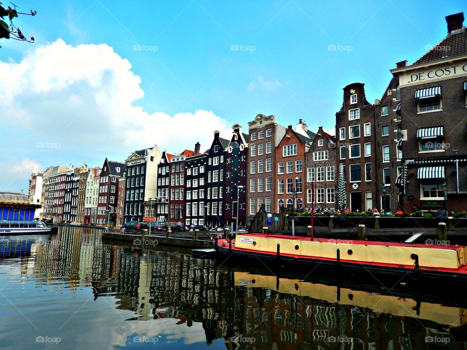 Amsterdam . View of houses by a canal 