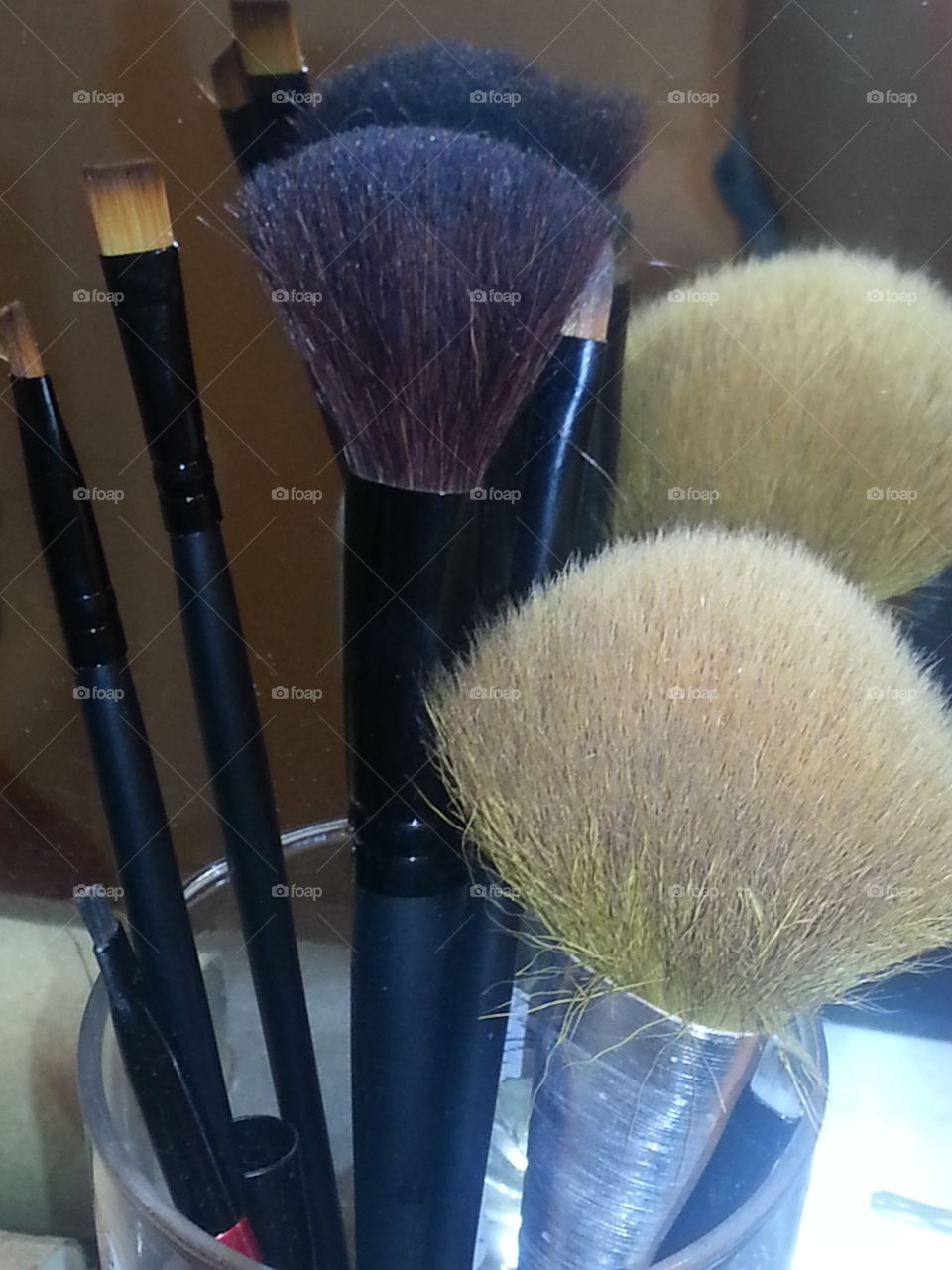 makeup brushes. makeup brushes in the mirror