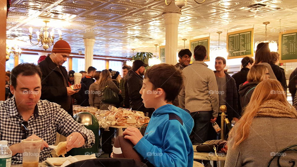 family at bagel shop. father and son