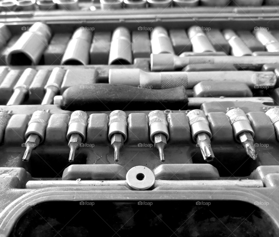 a set of repeating tools in a briefcase.