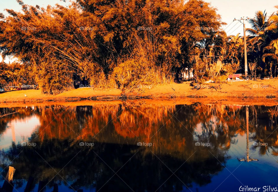 entardecer a beira rio