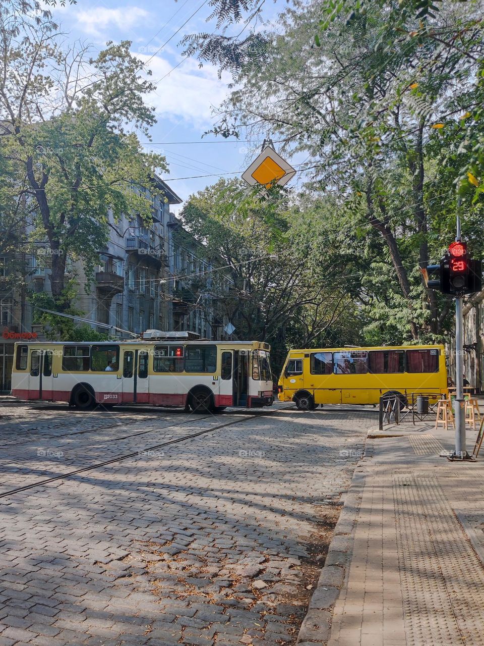 Meeting of the trolley bus and fixed-route taxi.