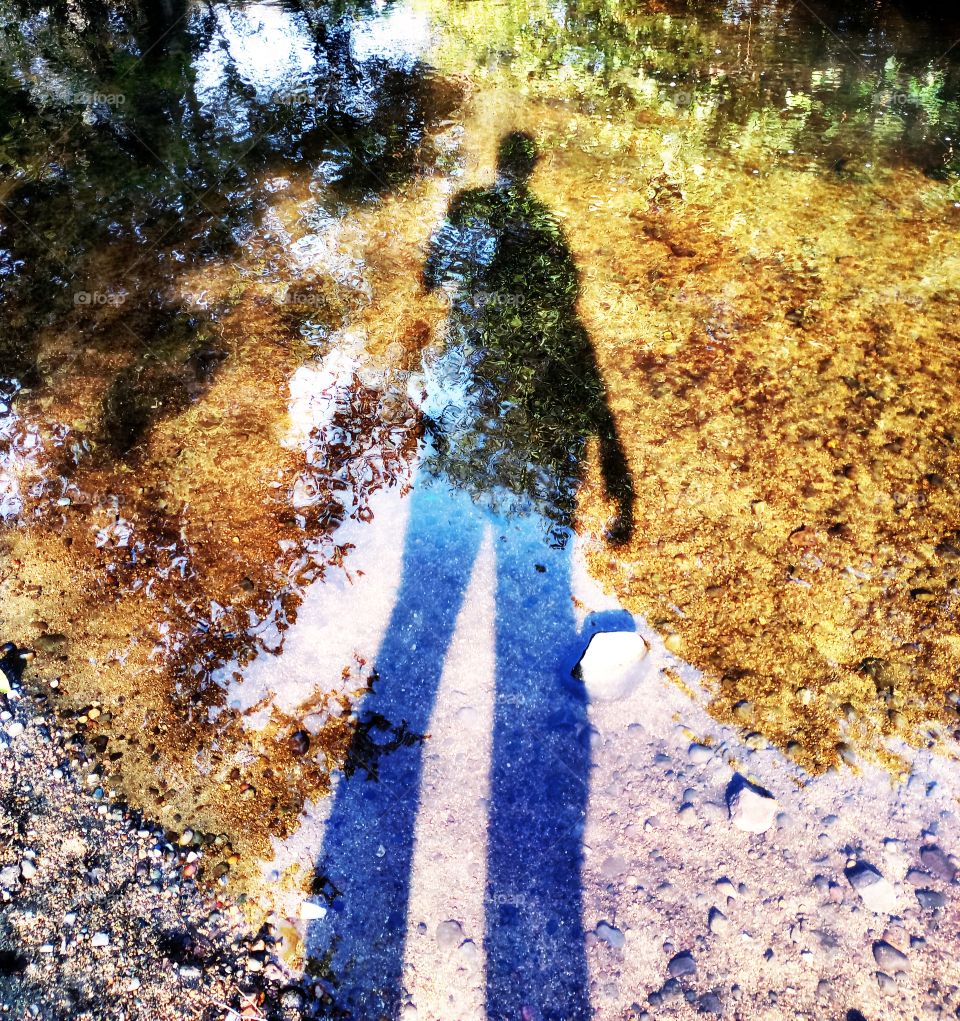 tall man river shadow