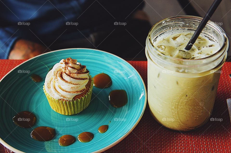 Apple cinnamon cupcake and an iced matcha latte.