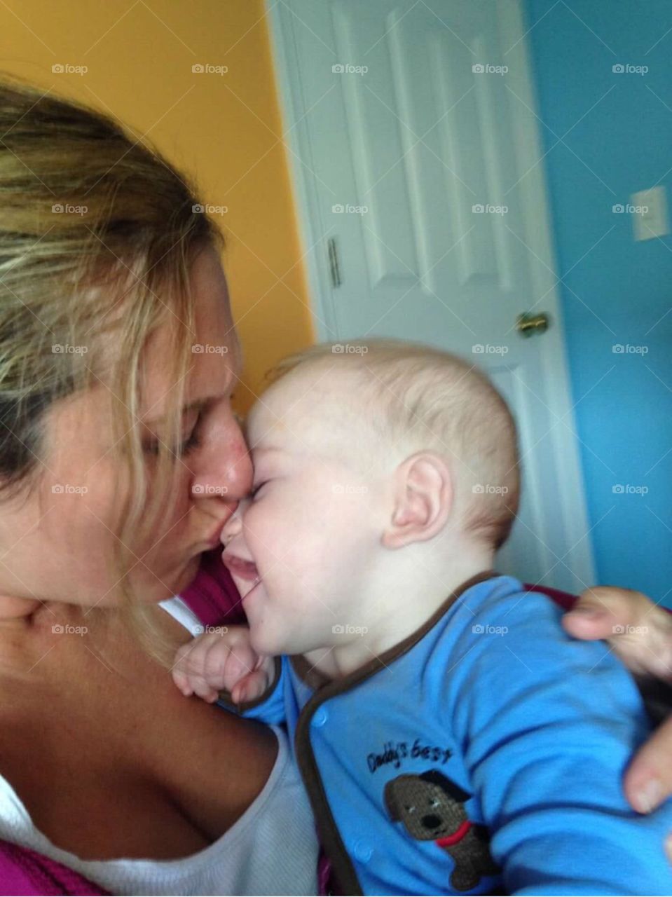 Mother kissing her son