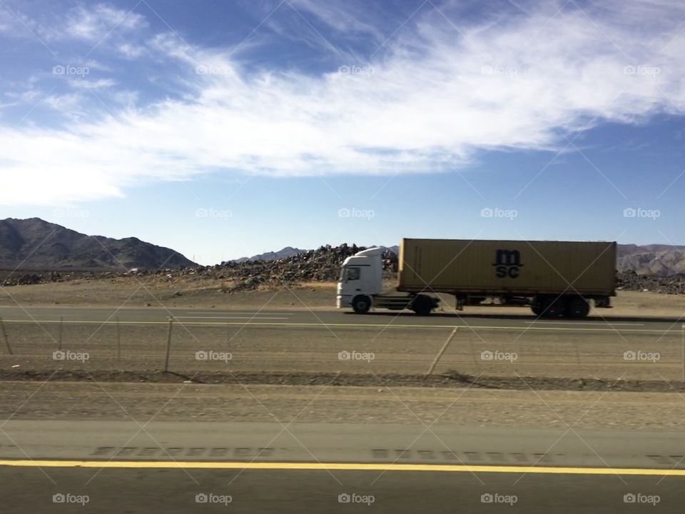 Truck on the desert road - saudi arabia