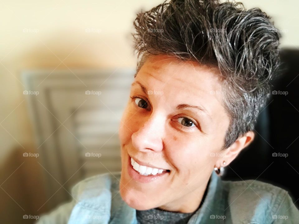 Closeup of woman’s face, LGBTQ community representation, skin on woman’s face, portrait of a woman, smiling for the camera, face in focus, focused on your face 