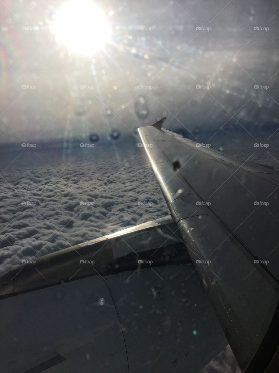 Airplane sun clouds 