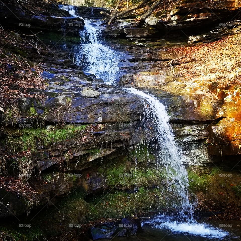 small roadside waterfall
