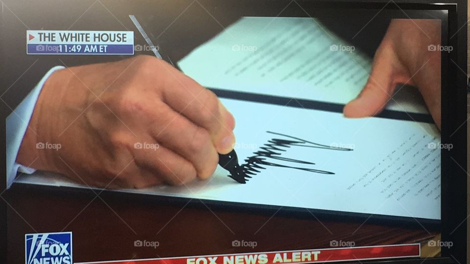 Donald Trump signing an Executive Order