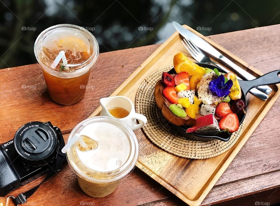 bowl of fruit and ice coffee