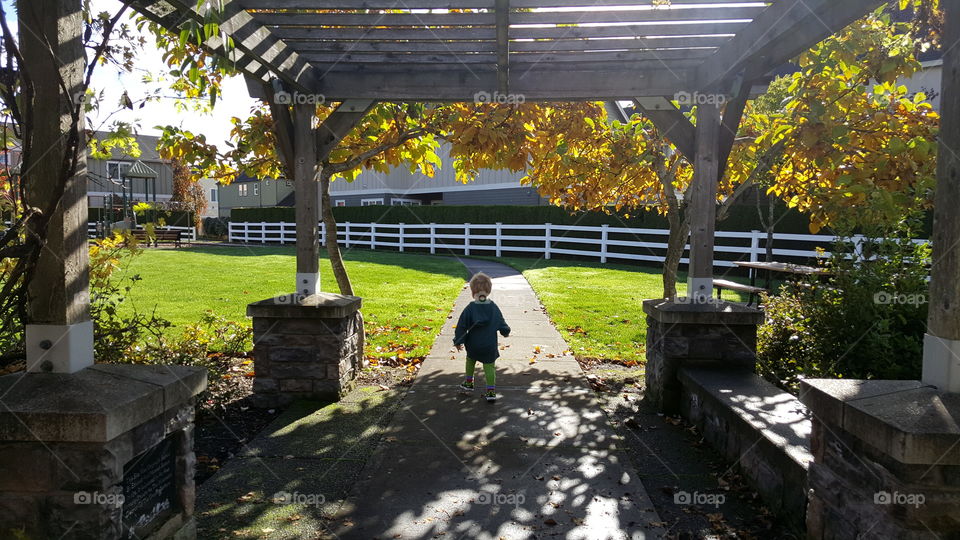 Toddler walking away from auntie