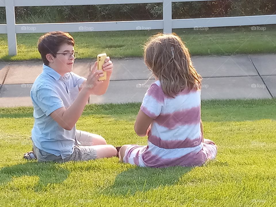 siblings enjoying their own time, documenting in pictures the memories as they are made. The live is so evident here.