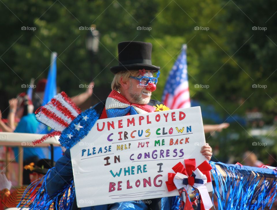 Clown in a Parade with Political Satire Statement 