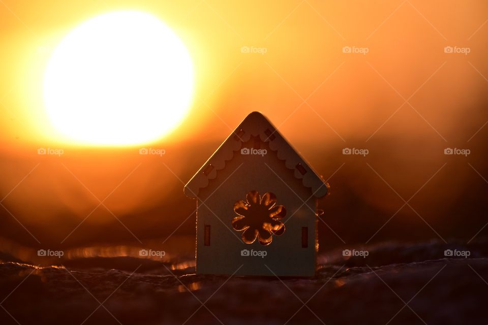 wooden house on sunset background