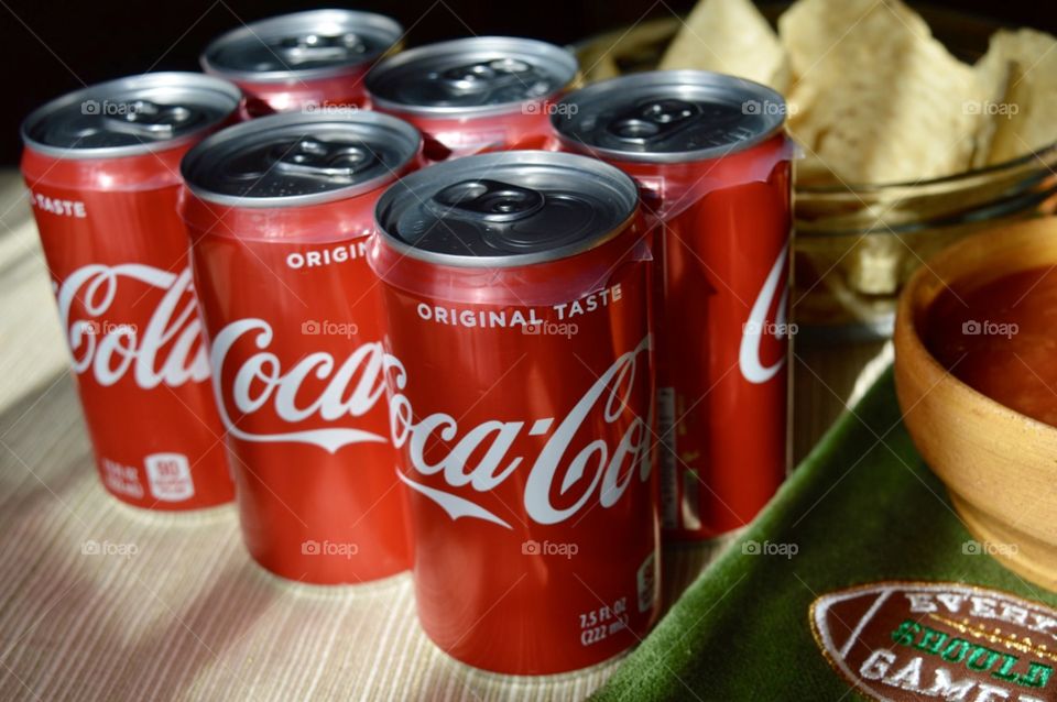 Coca-Cola with chips and salsa on game day
