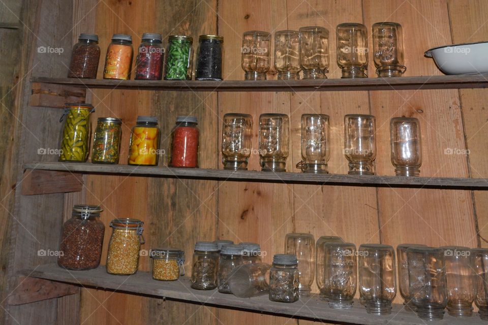 Old canning jar with food stored in them which you don't see these days