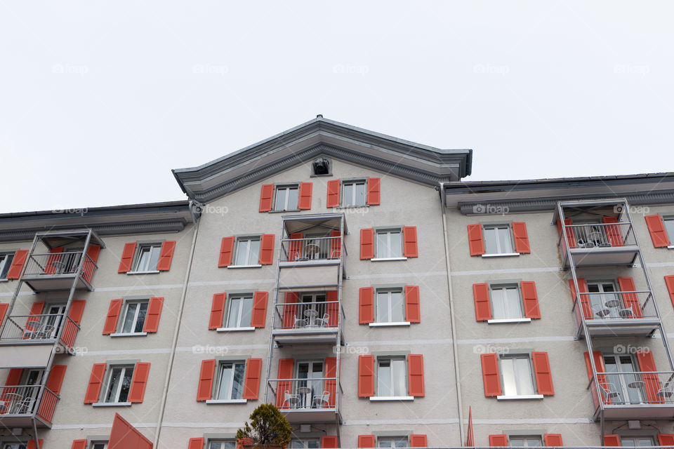 House in Switzerland with red shutters