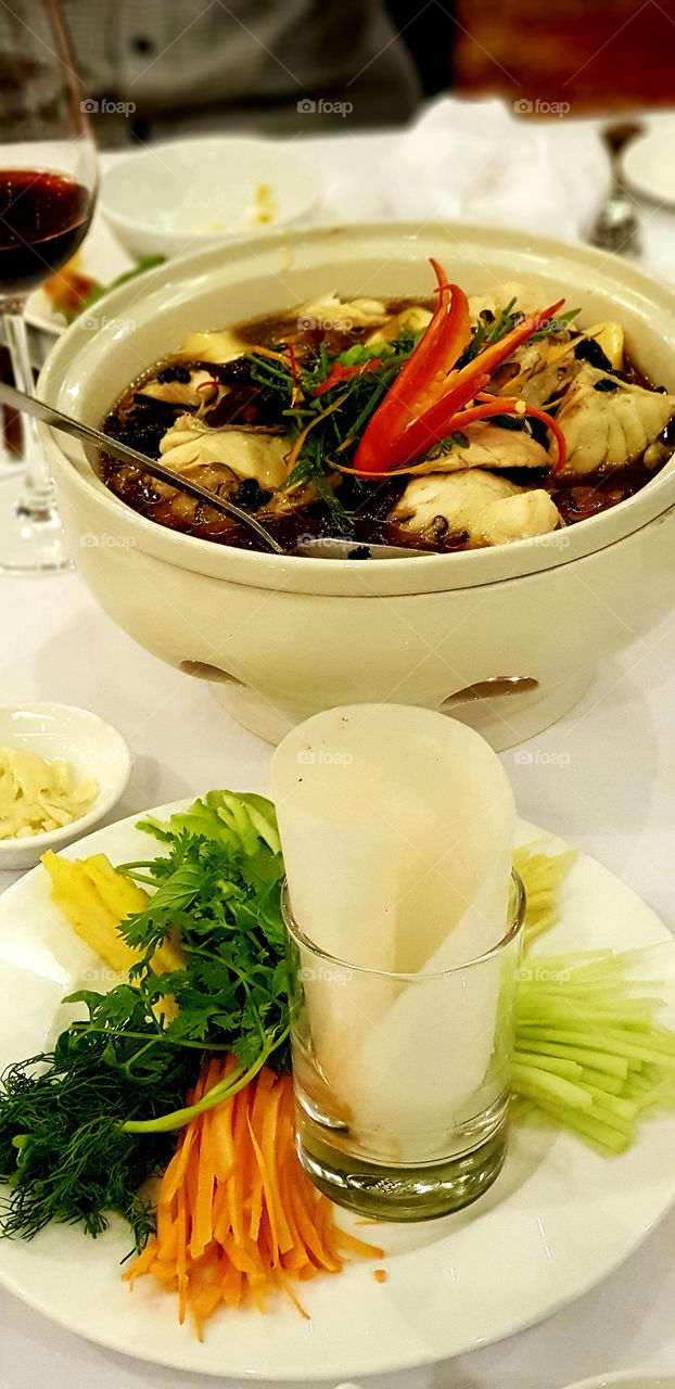 Vietnamese rice paper roll with fish soup