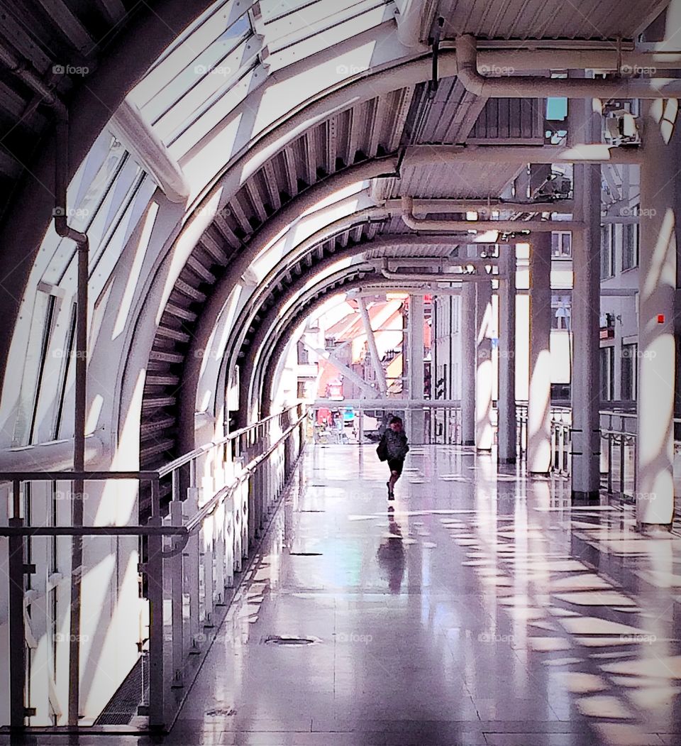 Boy running in a big buildingt. Ferry terminal in helsingborg