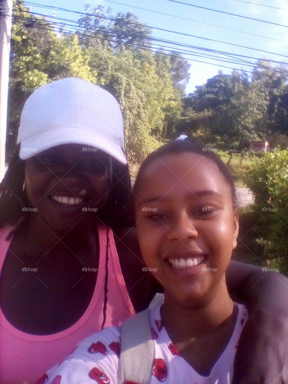 mother and daughter having a beautiful day and smiling for this beautiful picture very cute.