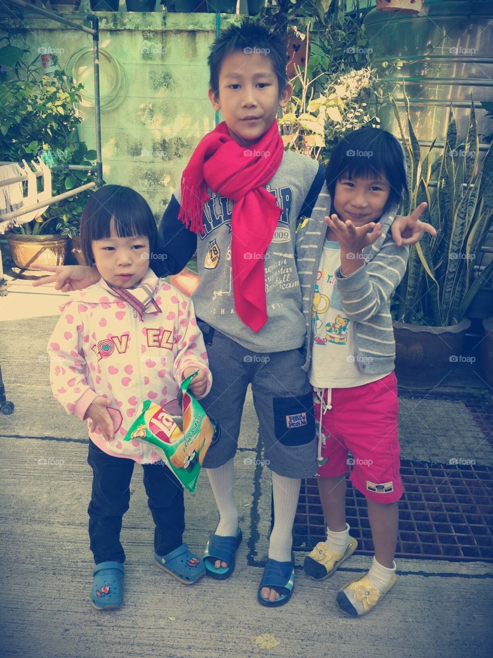 Happy Asian children enjoy outdoor.