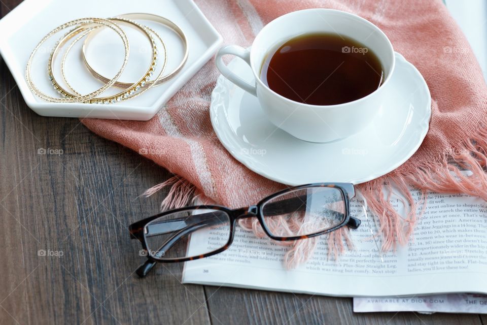 Coffee with glasses, magazine, scarf