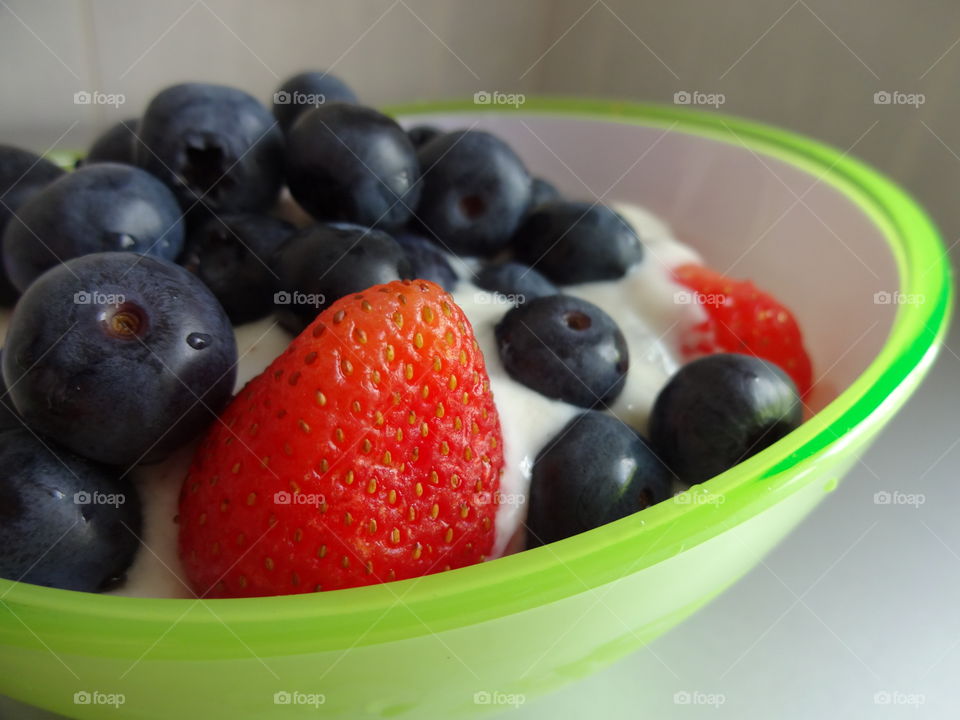 Breakfast full of vitamins with strawberry and yogurt
