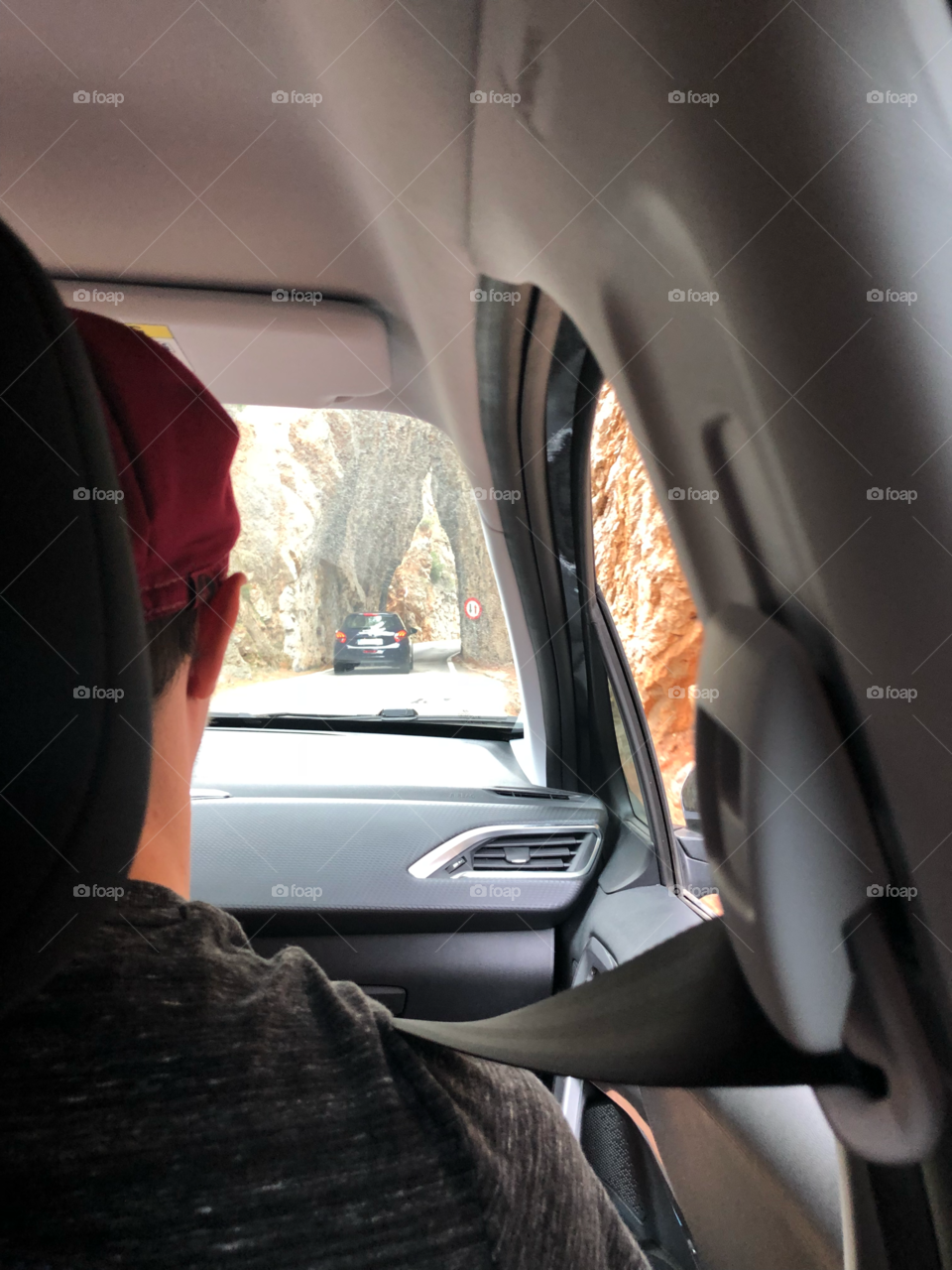 Mountain exploring in car back seat view 