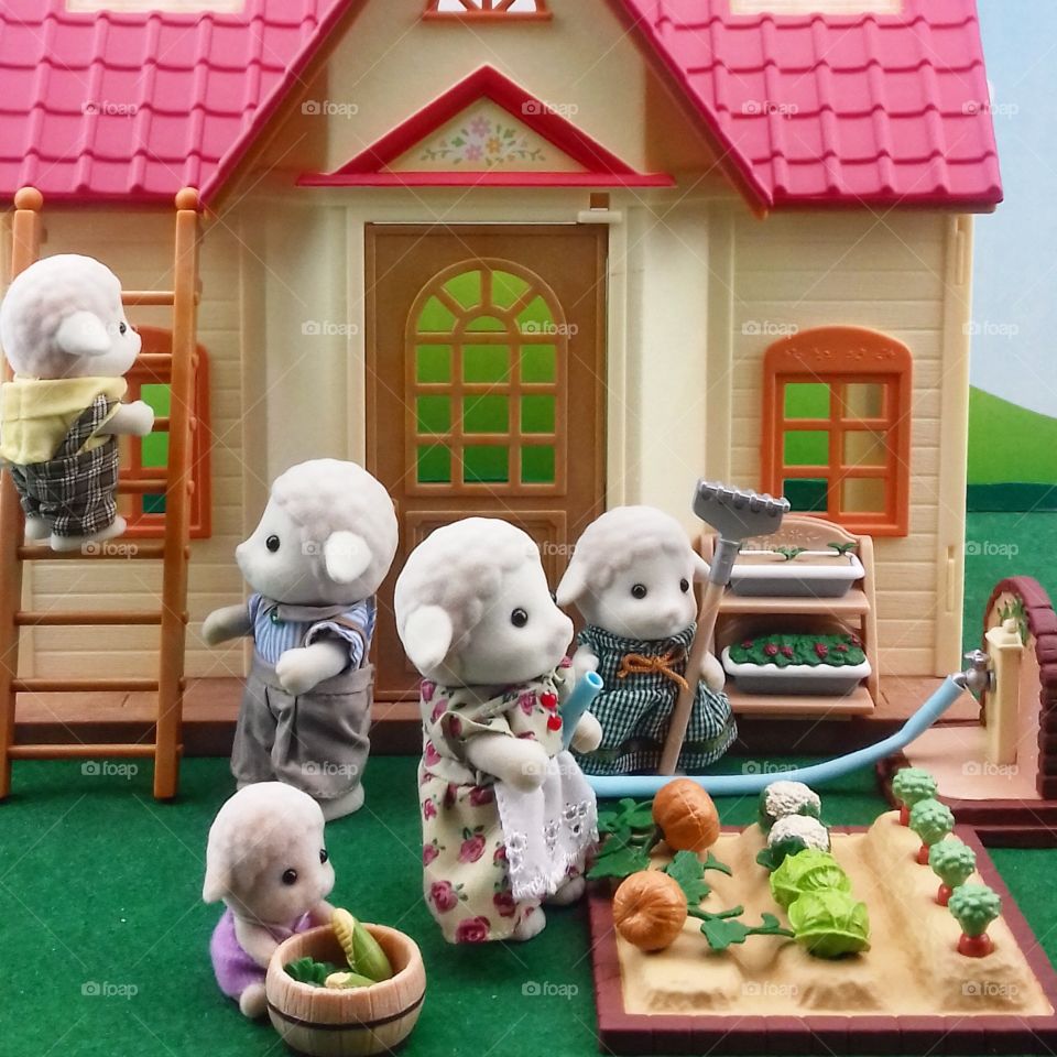 Toy Sheep Family Working at Home