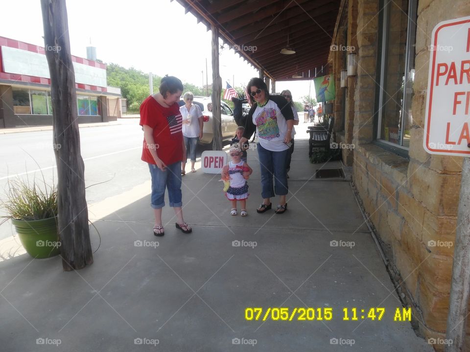 first fourth of July. This is a picture of a beautiful little girl who is attending her first fourth of July parade in Graham Texas