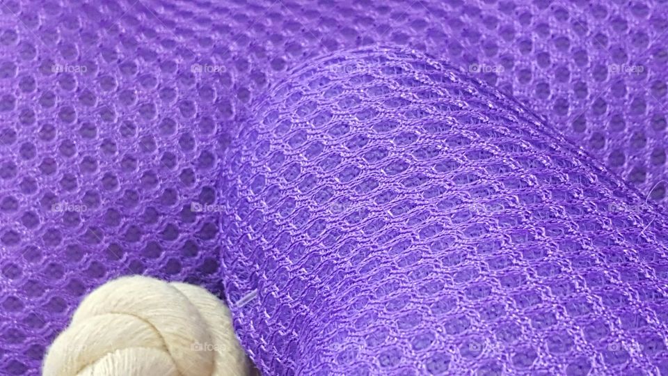 Close-up of ball of wool with knitting