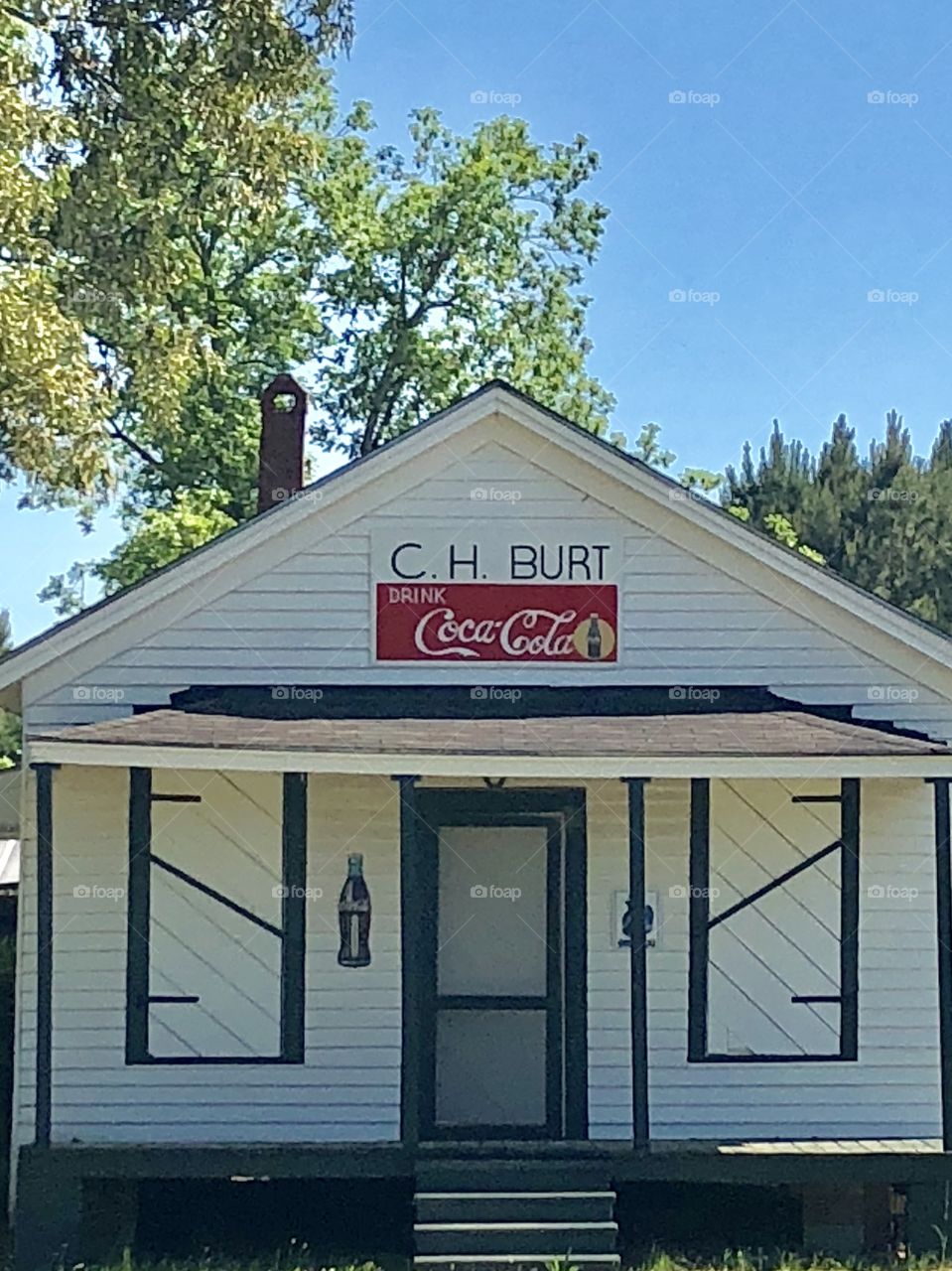 Old country store with Coca Cola sign on it. 