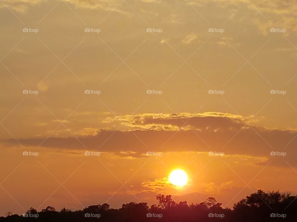 Sun nestled in the clouds