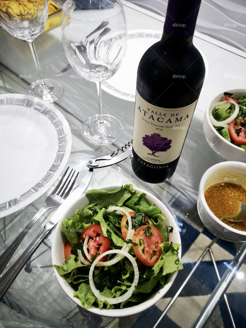 Salad, sauce and wine