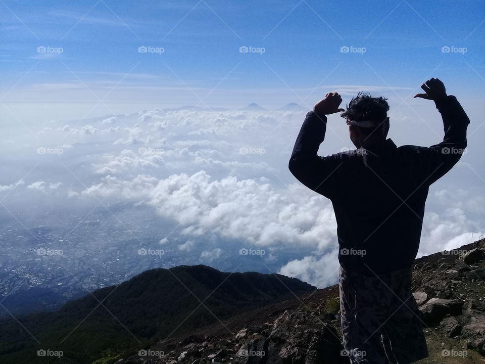 a man stands on a Mountain