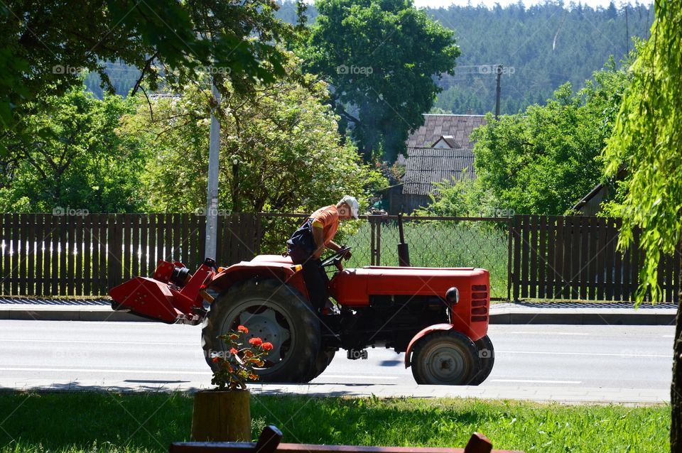 Red tractor at street