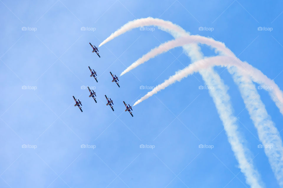 Al Fursan aerobatic team performing their tricks in the sky