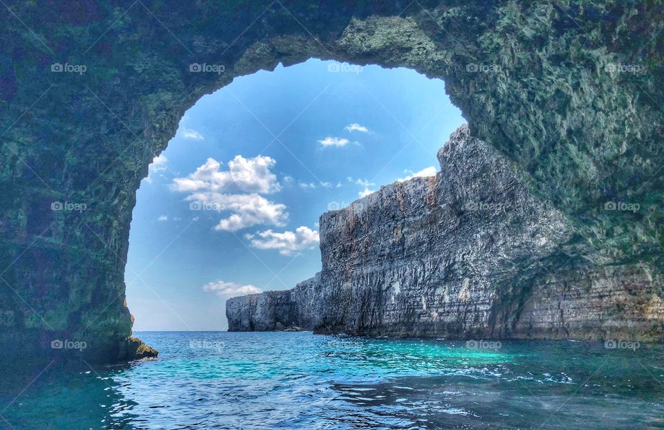 Cave in Malta. Blue sea