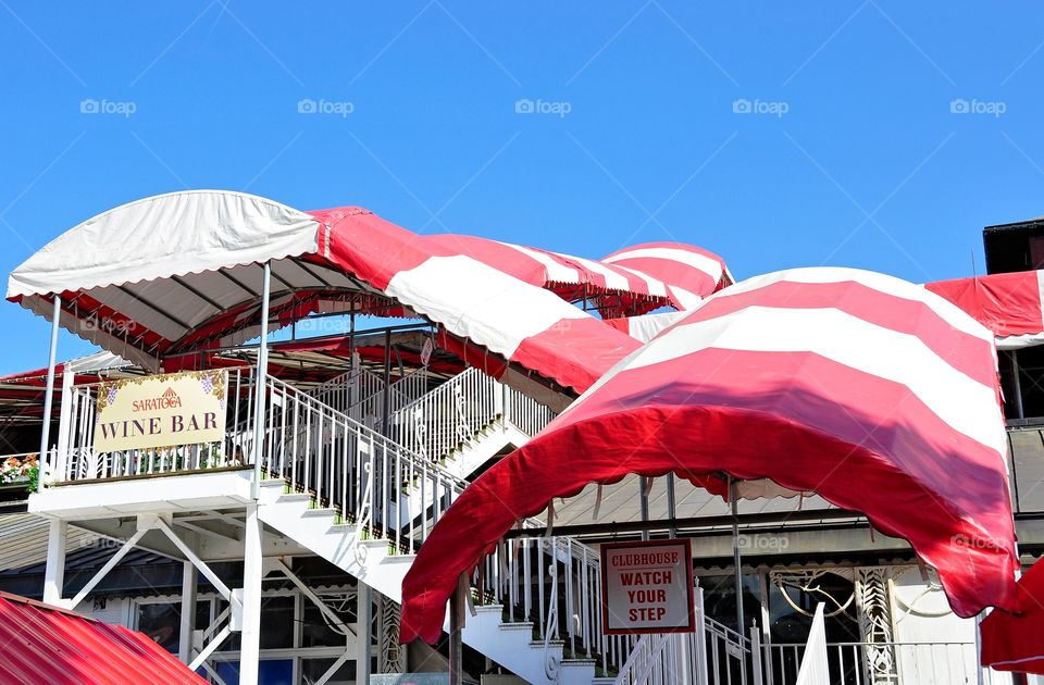Stairway to Heaven. Saratoga's iconic red and white awnings that cover the stairway to the oldest clubhouse in America. 
Fleetphoto