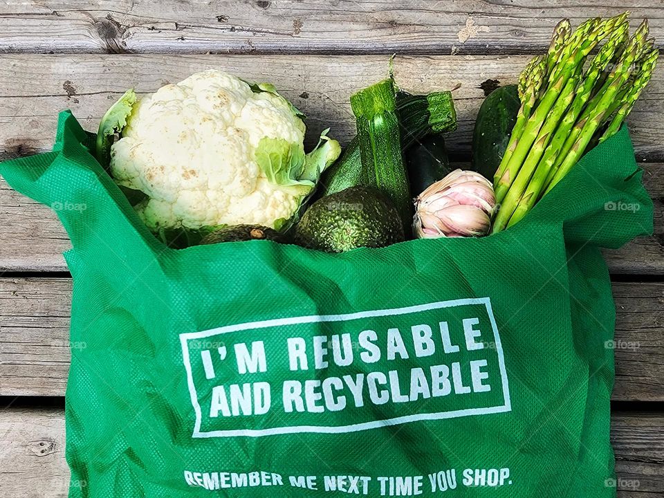 Fresh vegetables in a reusable grocery bag