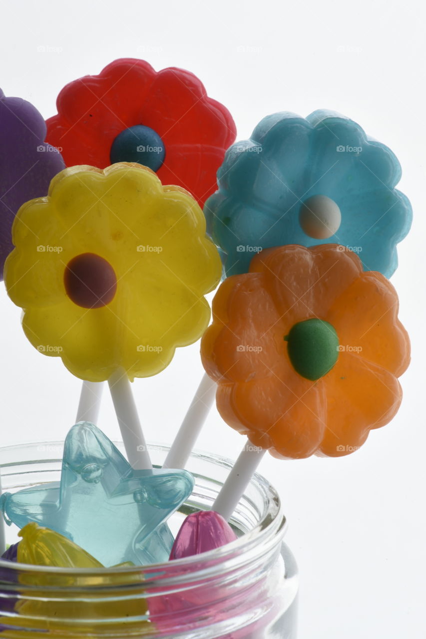 Sweet, colorful confection on stick.