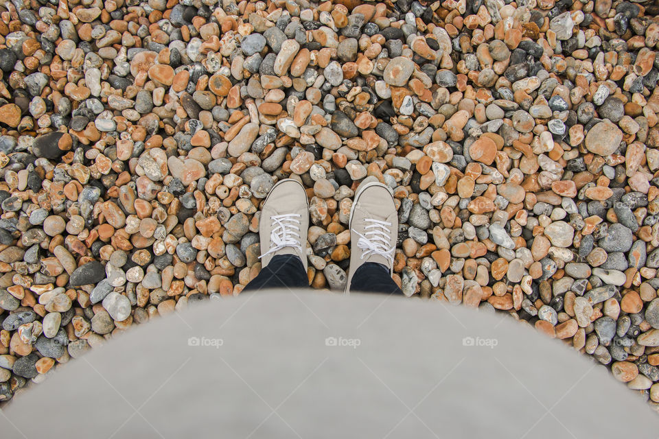 Future motherhood. Top view of stone ground with bump out of focus. Pregnancy.