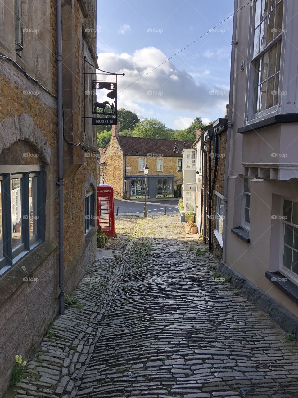 This delightful little pathway to the central point of Castle Cary is a reminder of the picturesque importance of this village. The red telephone box perhaps a reminder of days past and will earn its place in history in the future.