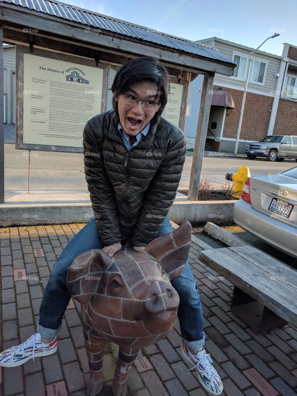 riding a brick piggy bank
