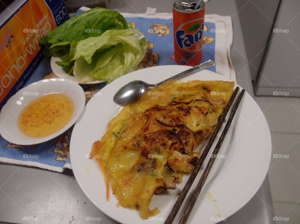 Vietnamese pancake eat with fish sauce and salad - homemade 