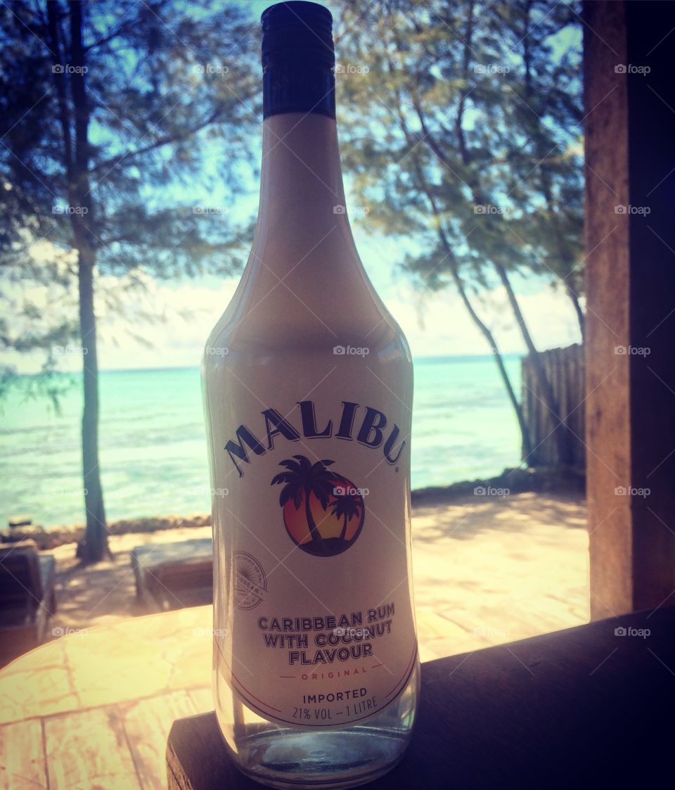 Malibu rum liquor by the tropical sea of Zanzibar. 