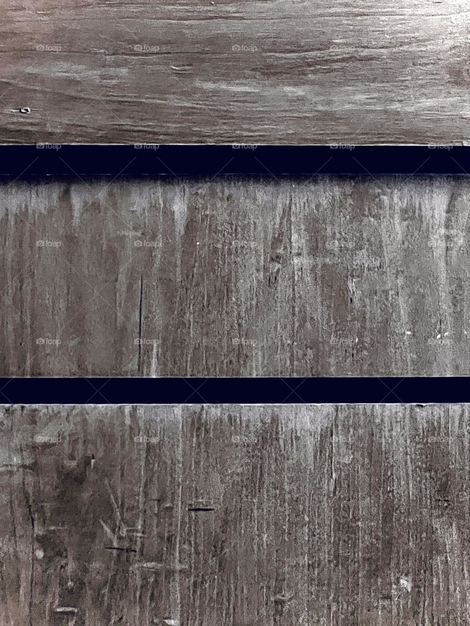 Distressed wood appearance on wall panels.