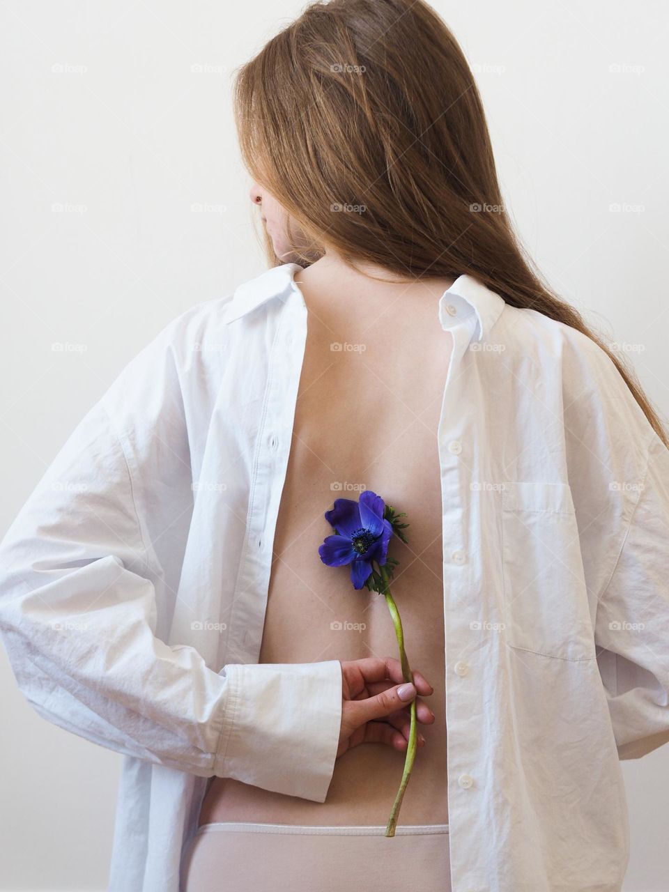 Back view of young beautiful girl with long hair