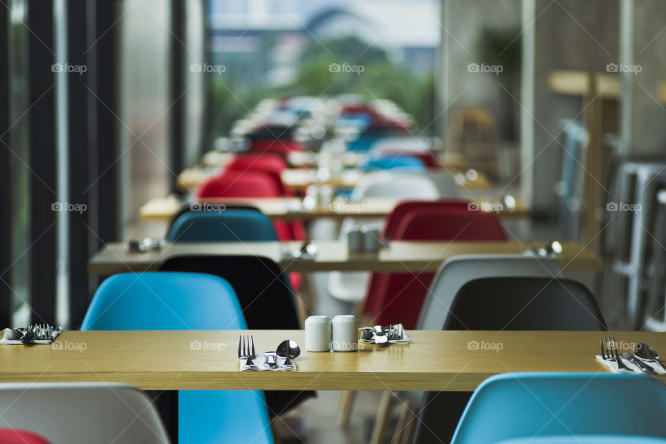 close up selective focus of a table set up in an empty restaurant